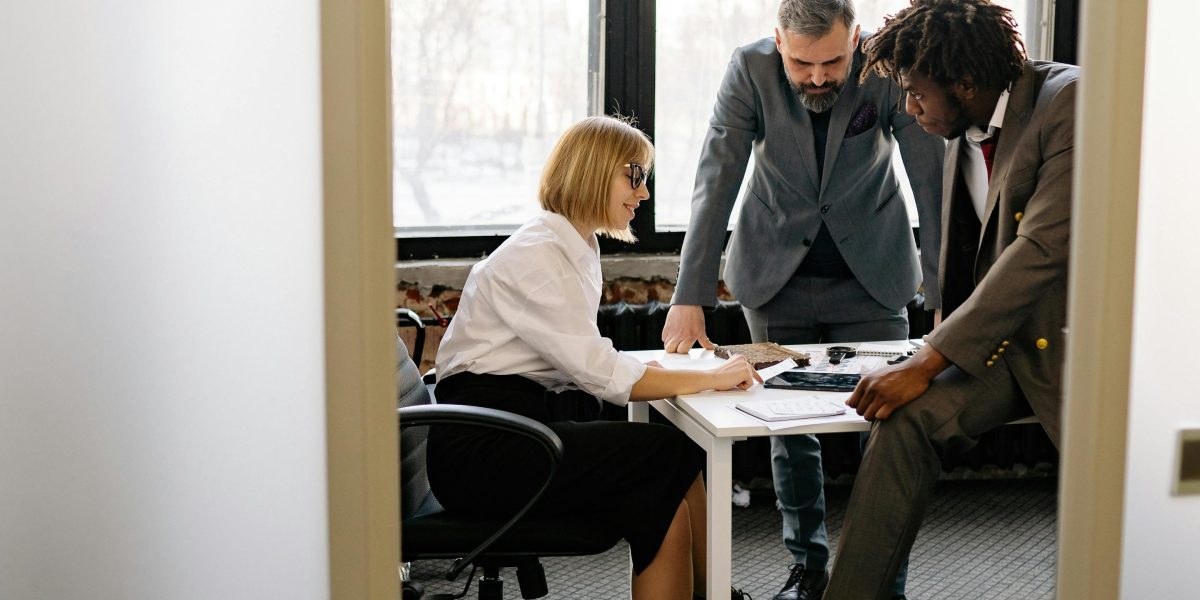Sales team in a modern office discussing strategy