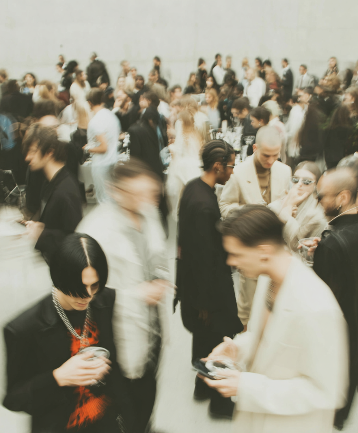 Professionals engaging in conversation and exchanging business cards at a local networking event.